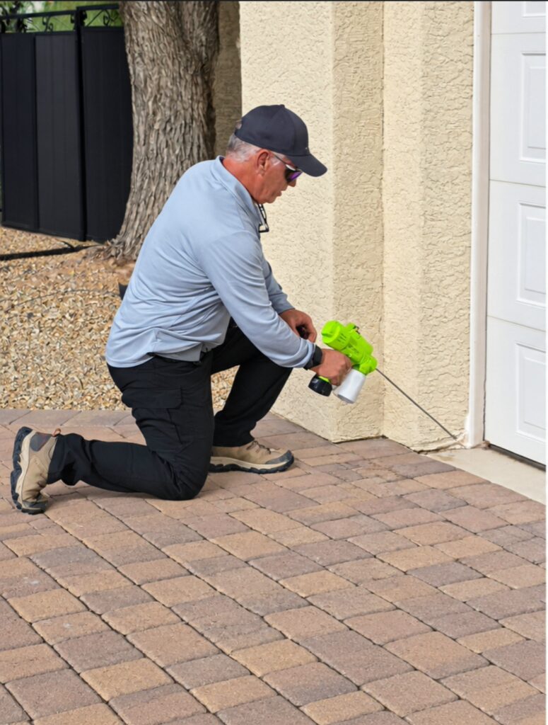 Harry Dusting for Scorpions Ozone Pest Control technician dusting a wall joint to keep scorpions out